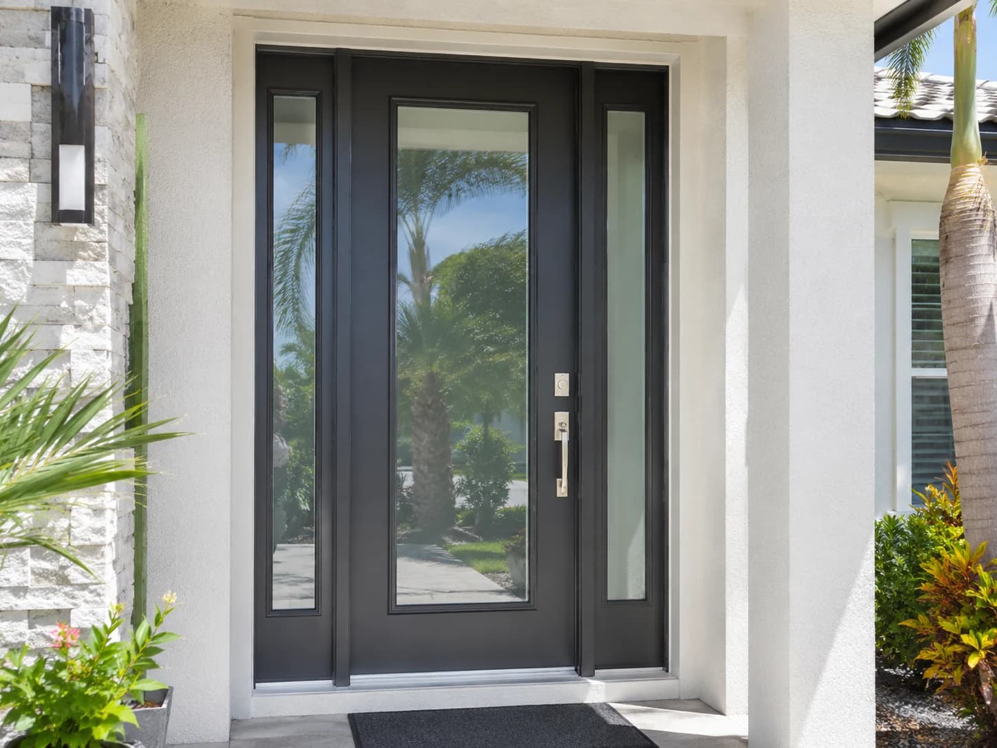 Modern dark impact entry door with side glass panels