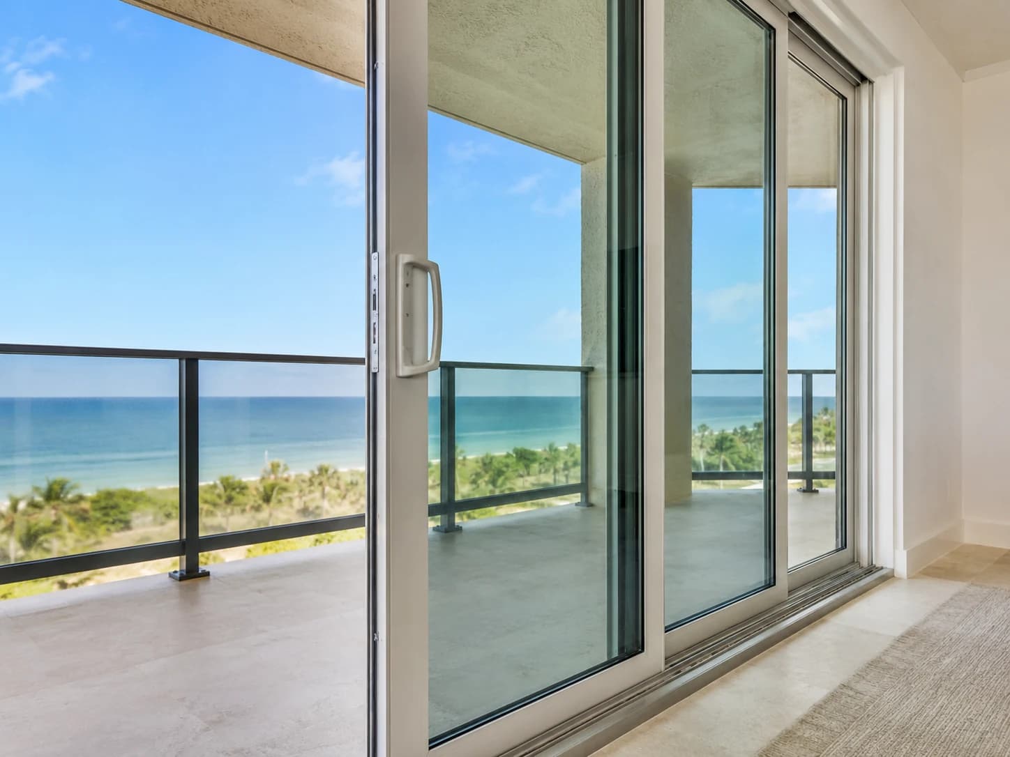 Impact patio slider beside a coastal balcony