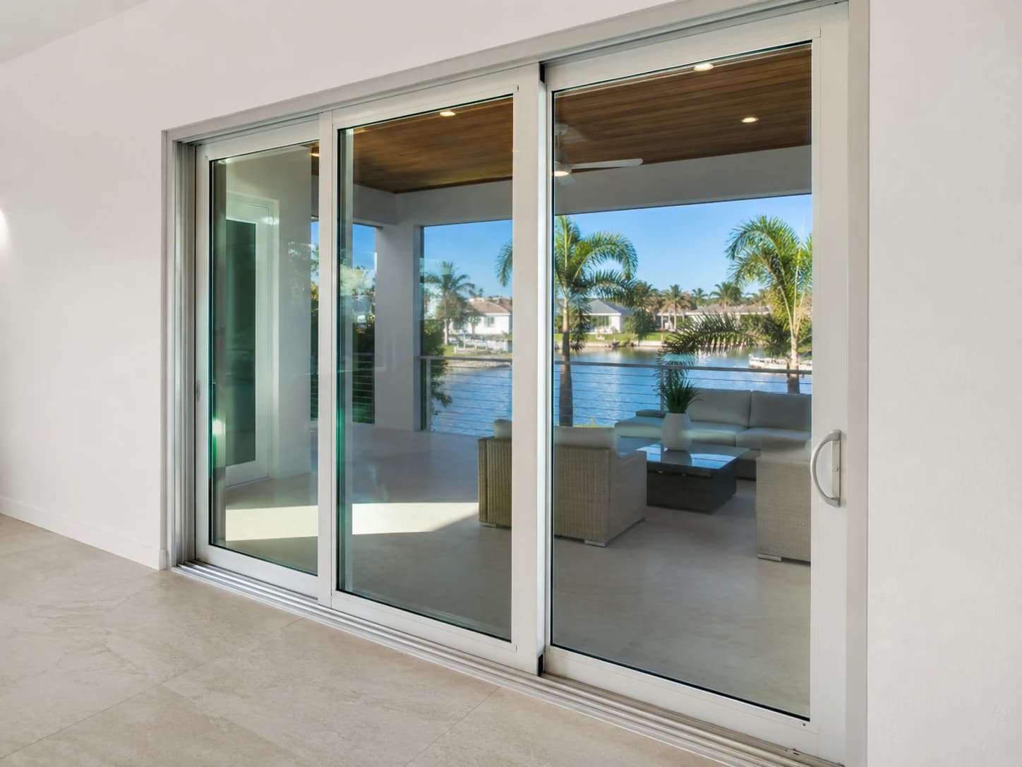 White impact sliding glass doors facing a patio
